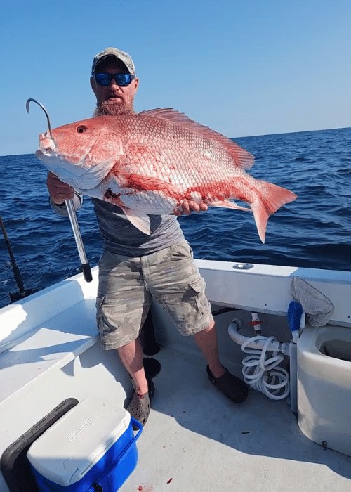 Angler holding a red snapper