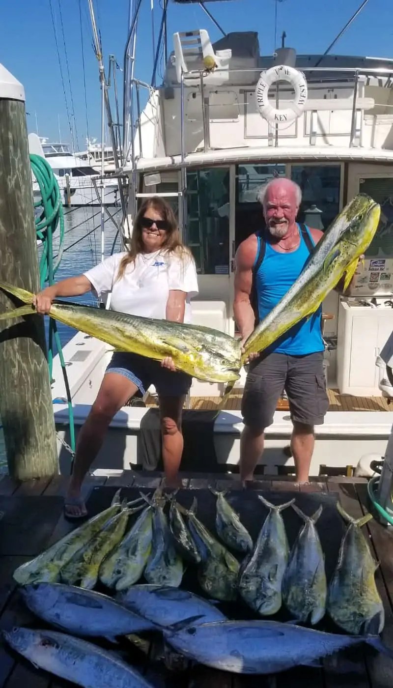 Anglers displaying mahi mahi at the stern with Triple Time Charters
