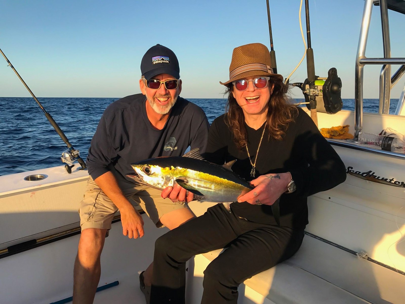 Anglers holding a mahi mahi with Key West Florida Fishing