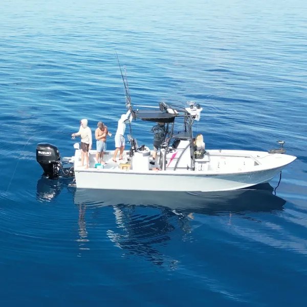 Aqua Delights center console fishing boat on calm water
