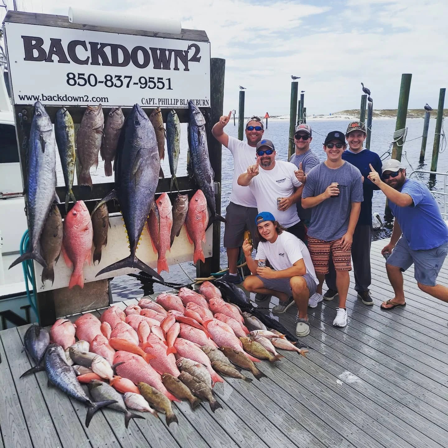 Fishing party with a dockside catch