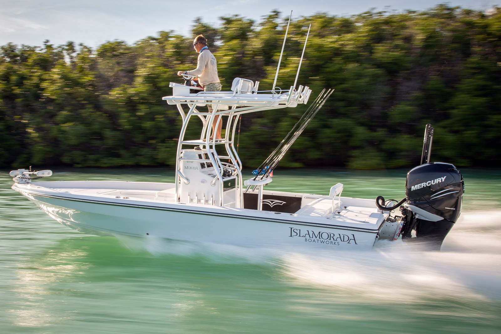 Center console fishing boat beside mangroves with Florida Keys Fun Fishing