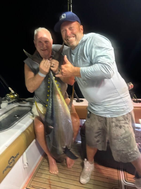 Angler holding a tuna
