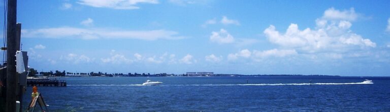 Water beside Dunedin Causeway with a boat wake and distant shoreline in 2006