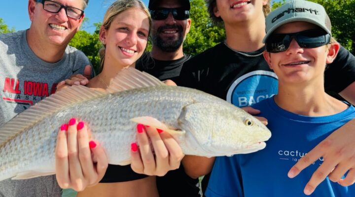 Family displaying a catch aboard Six Chuter Charters