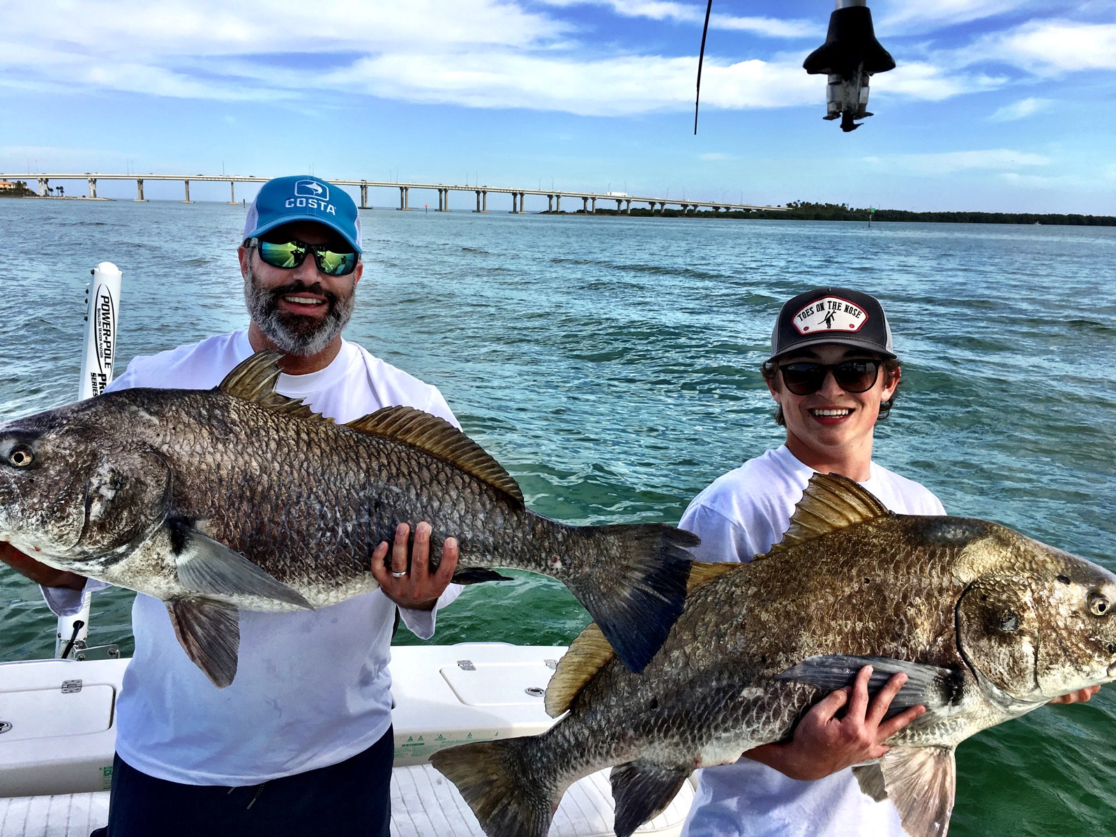 Fish Hawk Fishing Charters anglers holding black drum