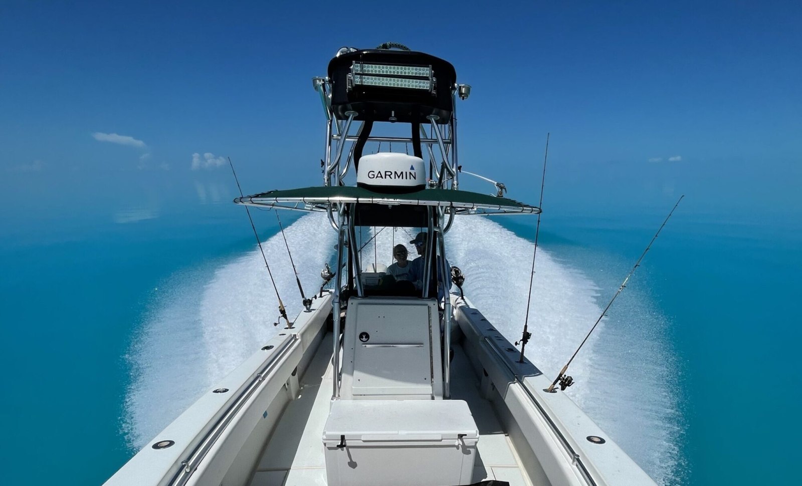 Fishing boat underway viewed from the bow with Tight N Up Charters