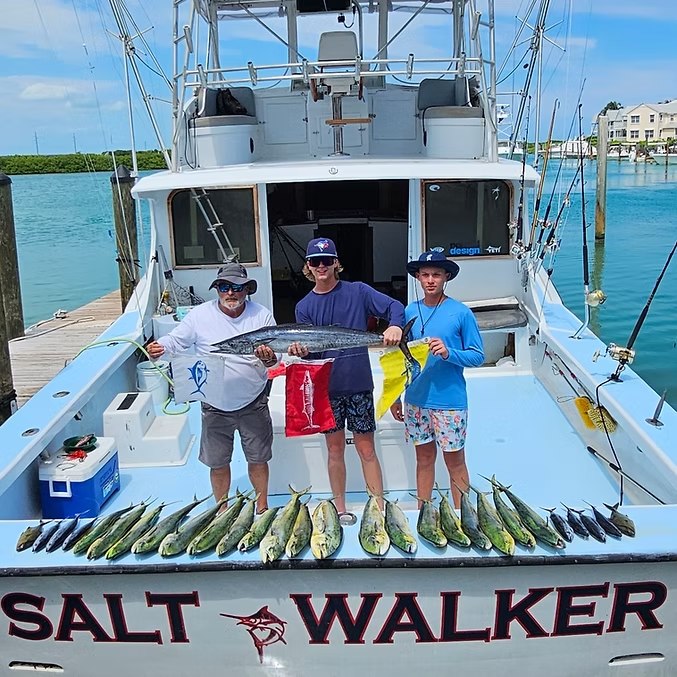Fishing group and catch at the stern of Salt Walker with SaltWalker Sportfishing Charters