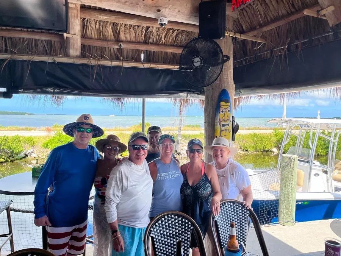 Fishing group displaying a large catch dockside with Salty Paradise Charters