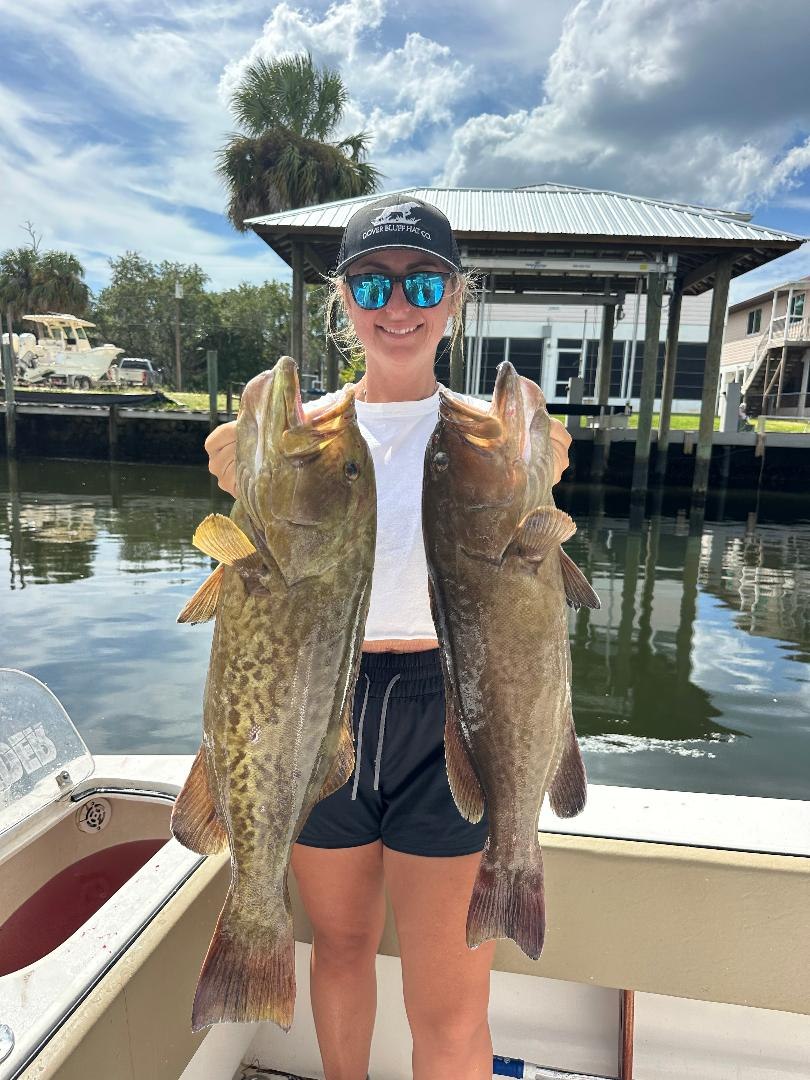 FishNFL young angler displaying two fish aboard the boat