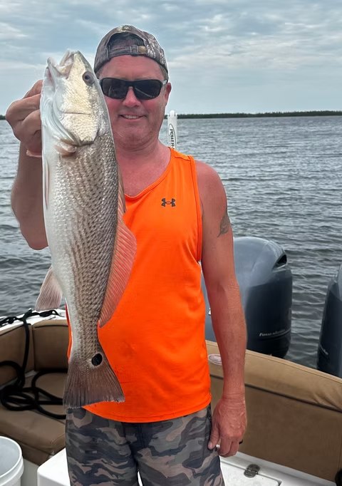 Florida Gulf Adventures angler holding a snook