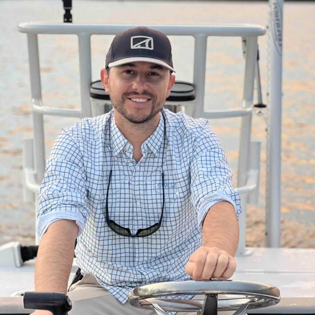 Fly Fish Sarasota captain seated at the boat helm