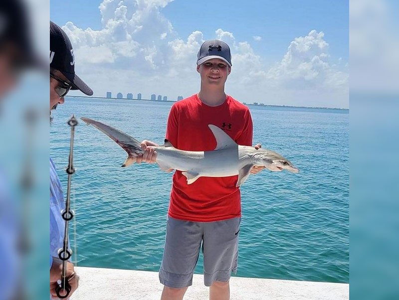 Good Time Charters angler holding a snook