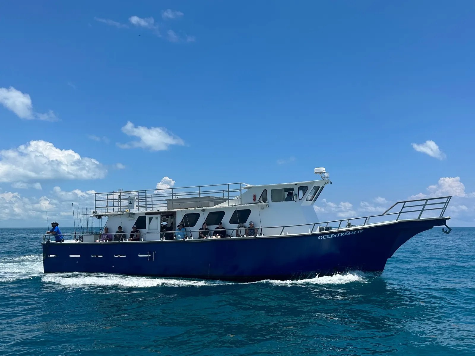 Gulfstream party fishing boat on the water with Gulfstream Fishing