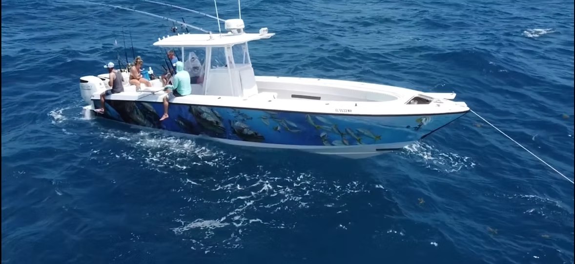 Heading West blue center console charter boat at sea