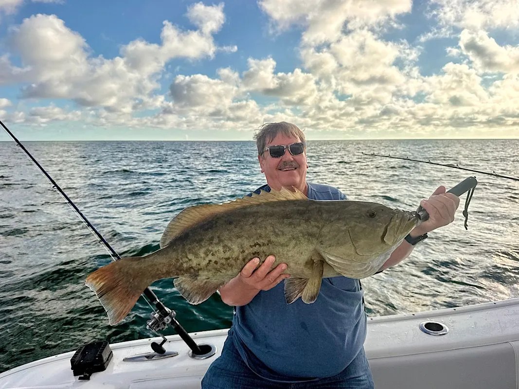 High Octane Fishing angler holding a grouper offshore