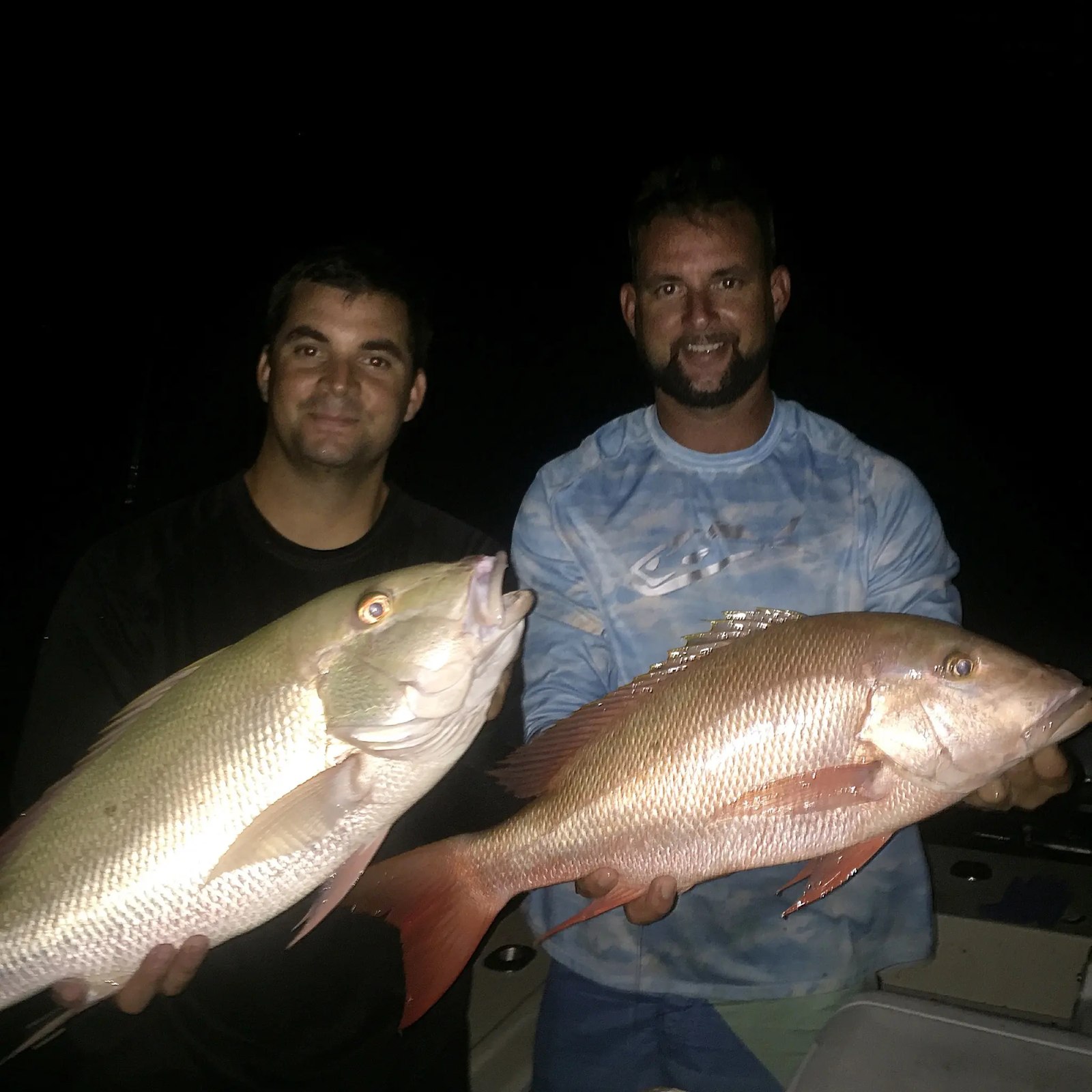 Off Her Radar anglers displaying snapper at night