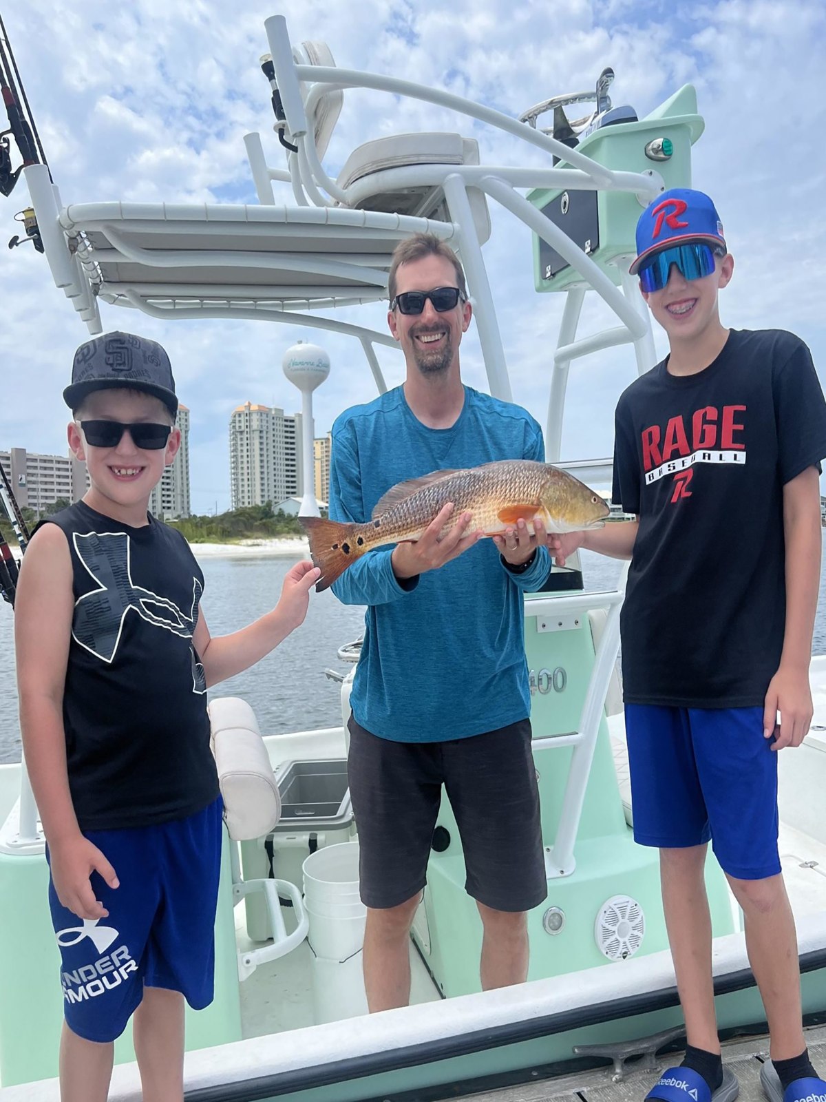 Anglers with a catch aboard the fishing boat