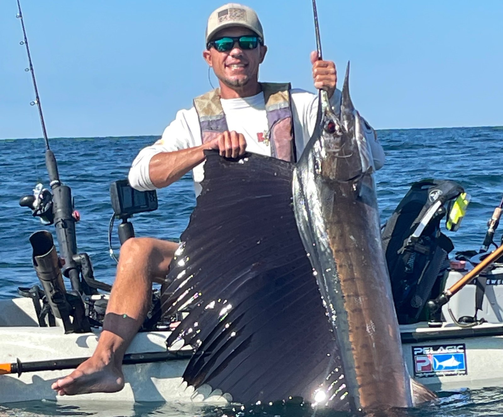 Kayak angler displaying a fish