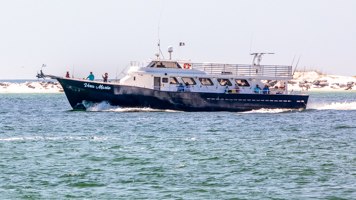 Pelican Adventures fishing boat on the water