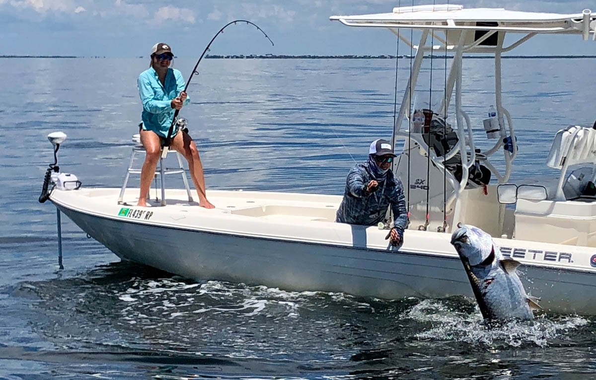 Reel Fishing Charters angler fighting a fish from a Pathfinder boat