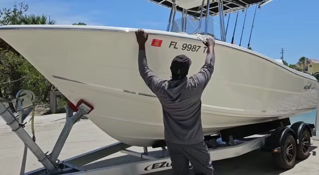 Reel Rebels white fishing boat on a trailer