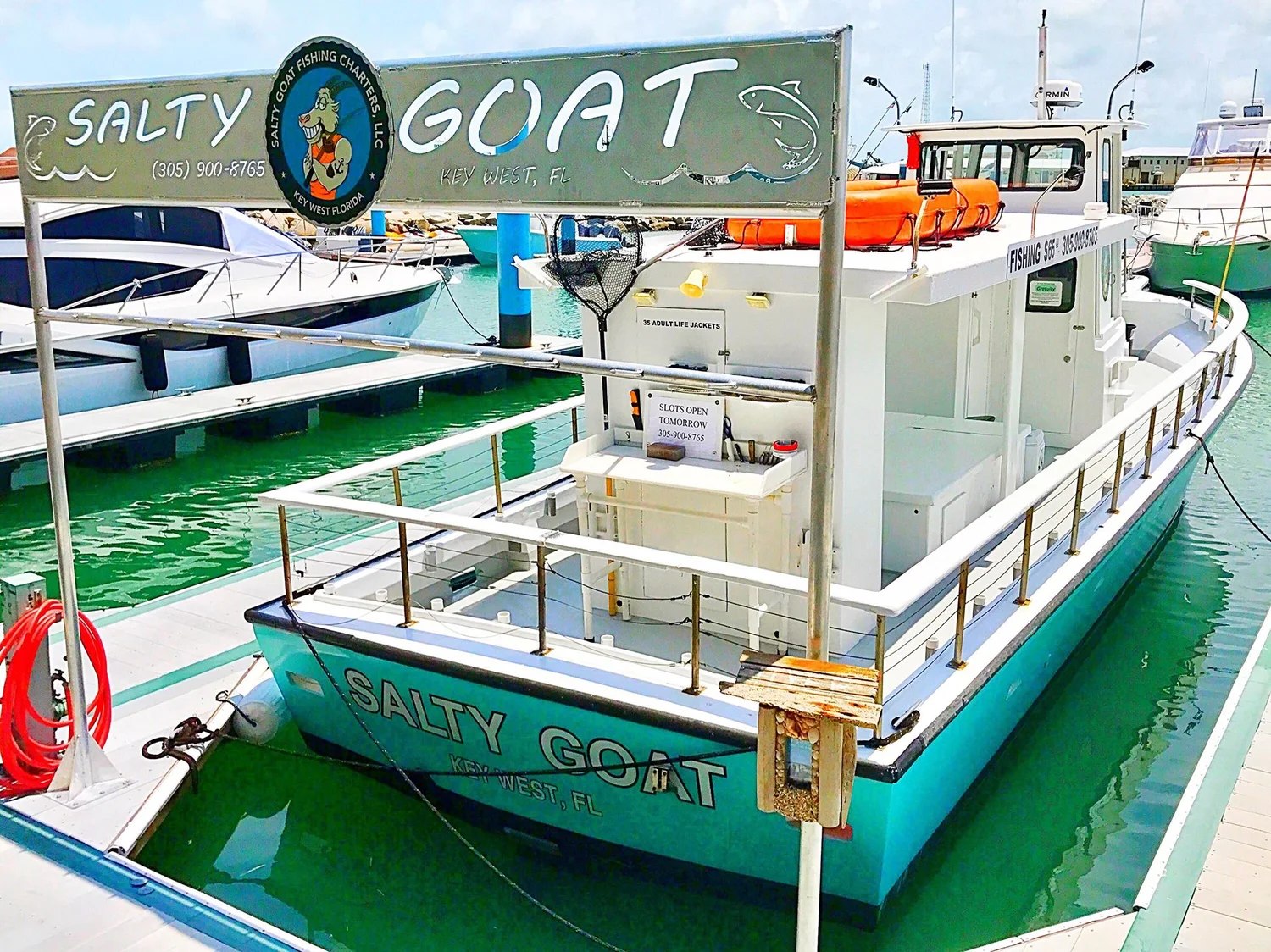 Salty Goat fishing boat moored at the dock with Salty Goat Fishing Charters