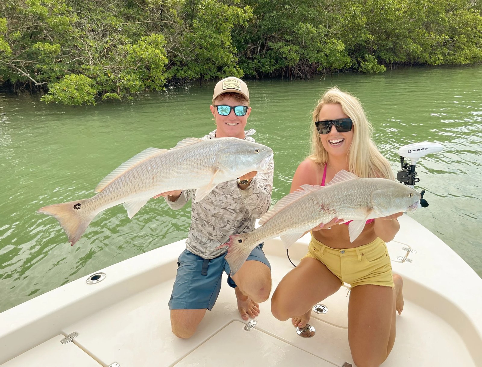 Southwest Slam Fishing Charters two anglers displaying snook