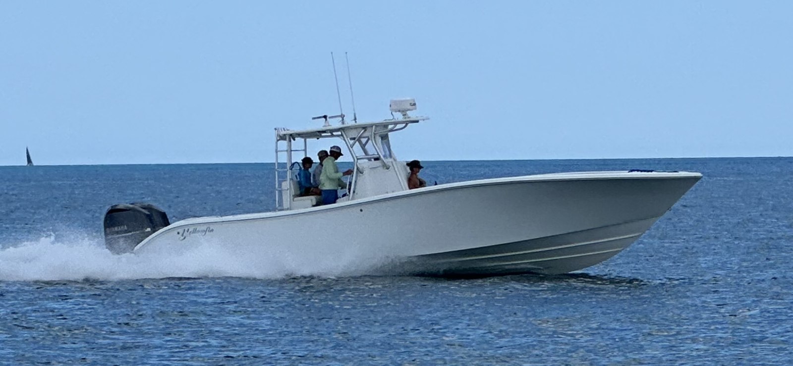Top Priority white center console fishing boat underway