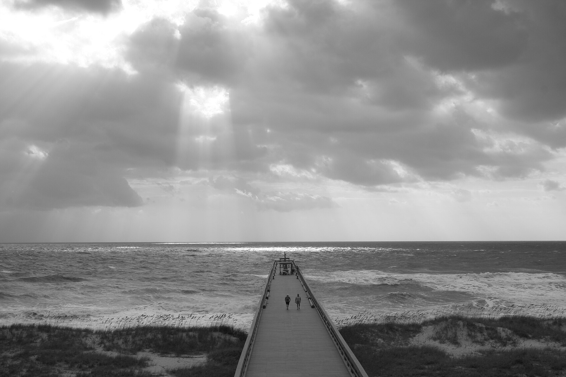 Black-and-white 2005 view of a pier extending into the Atlantic at Amelia Island