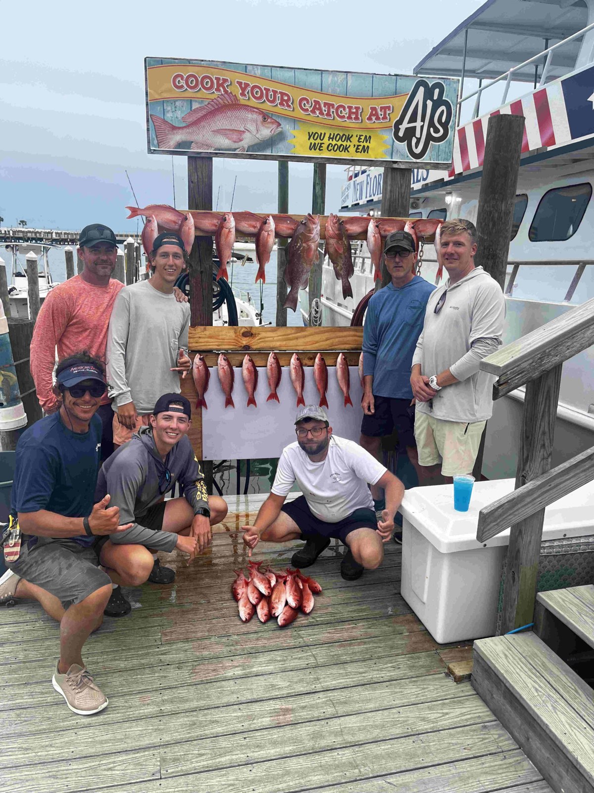 American Spirit fishing guests with their catch at the dock