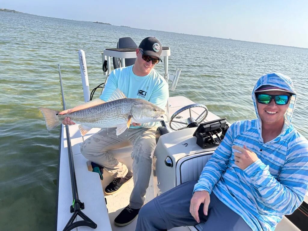 Amplifly Charters anglers aboard a lagoon fishing skiff