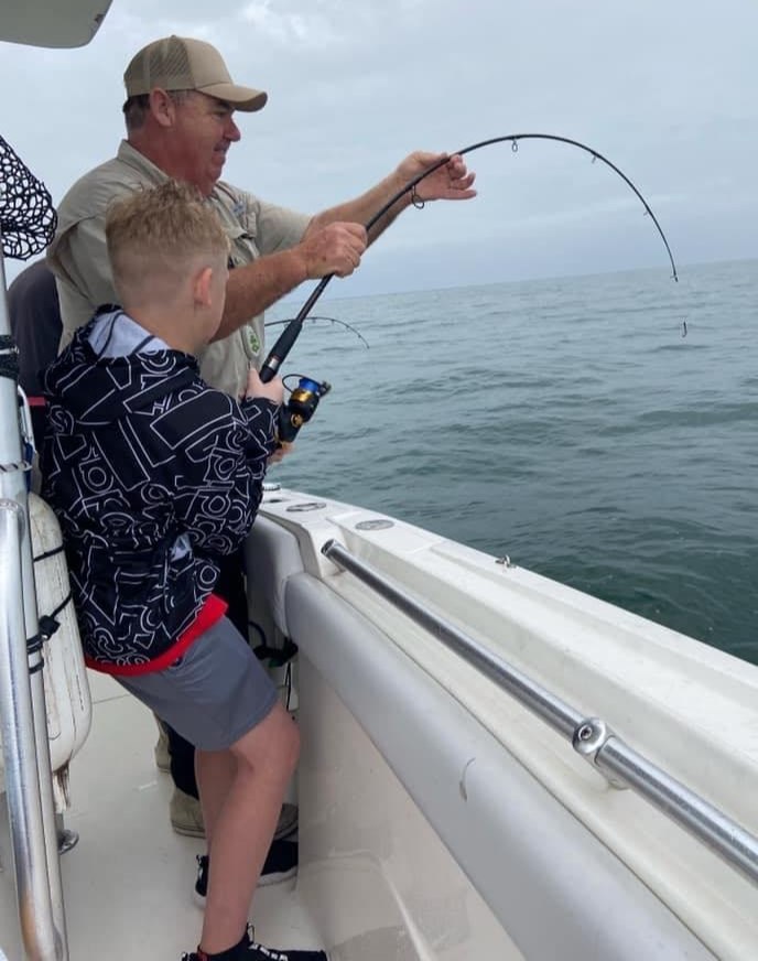 Angler fighting a fish aboard Castaway STA