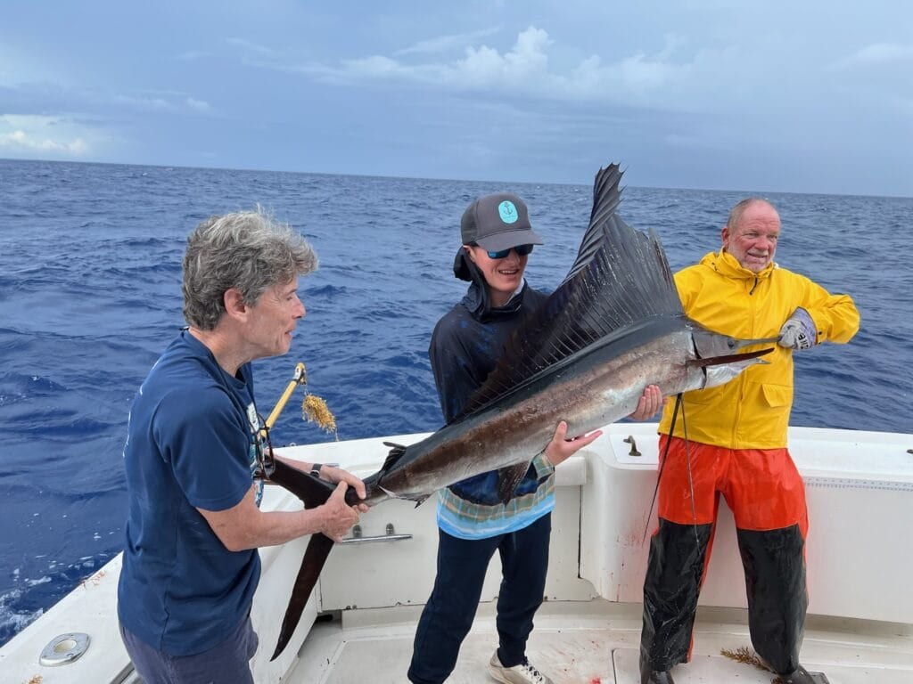 Anglers with a sailfish on a Gonzo Charters outing