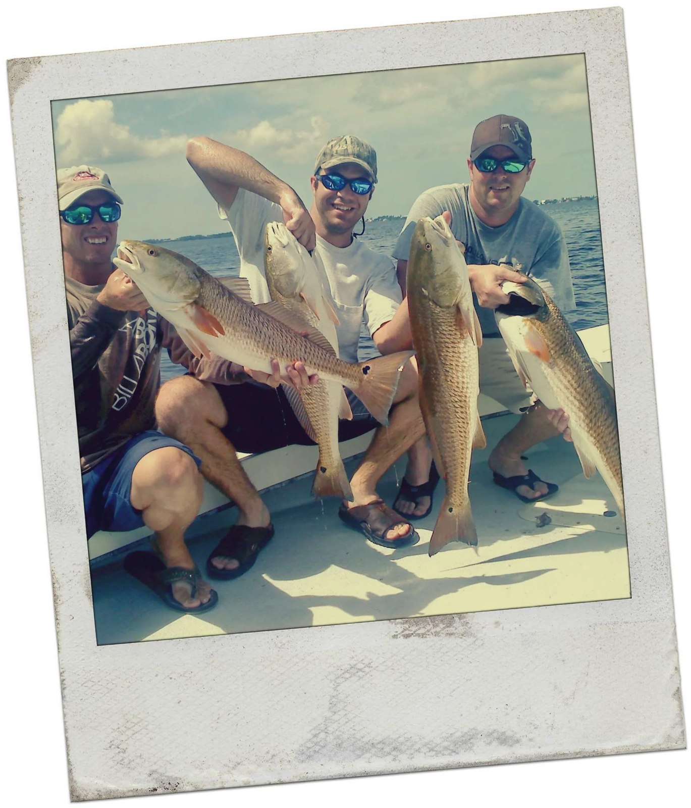 Anna Maria Inshore Fishing guests holding their catch in a framed photo
