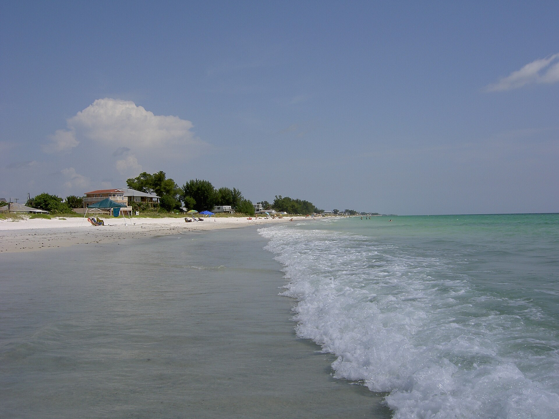 Small Gulf waves washing onto the sandy shore of Anna Maria Island