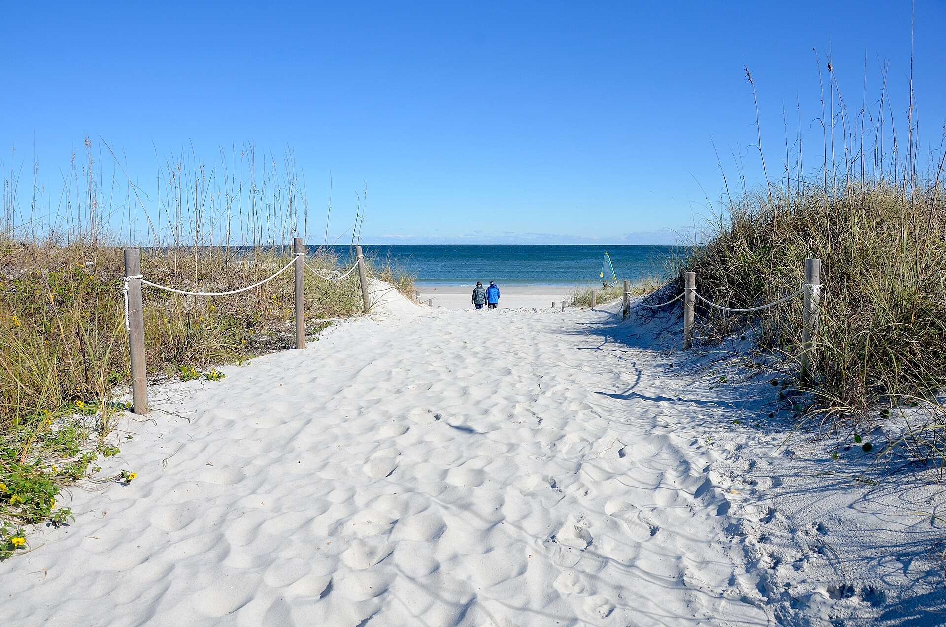 Sandy public crossing between dune vegetation at Atlantic Beach