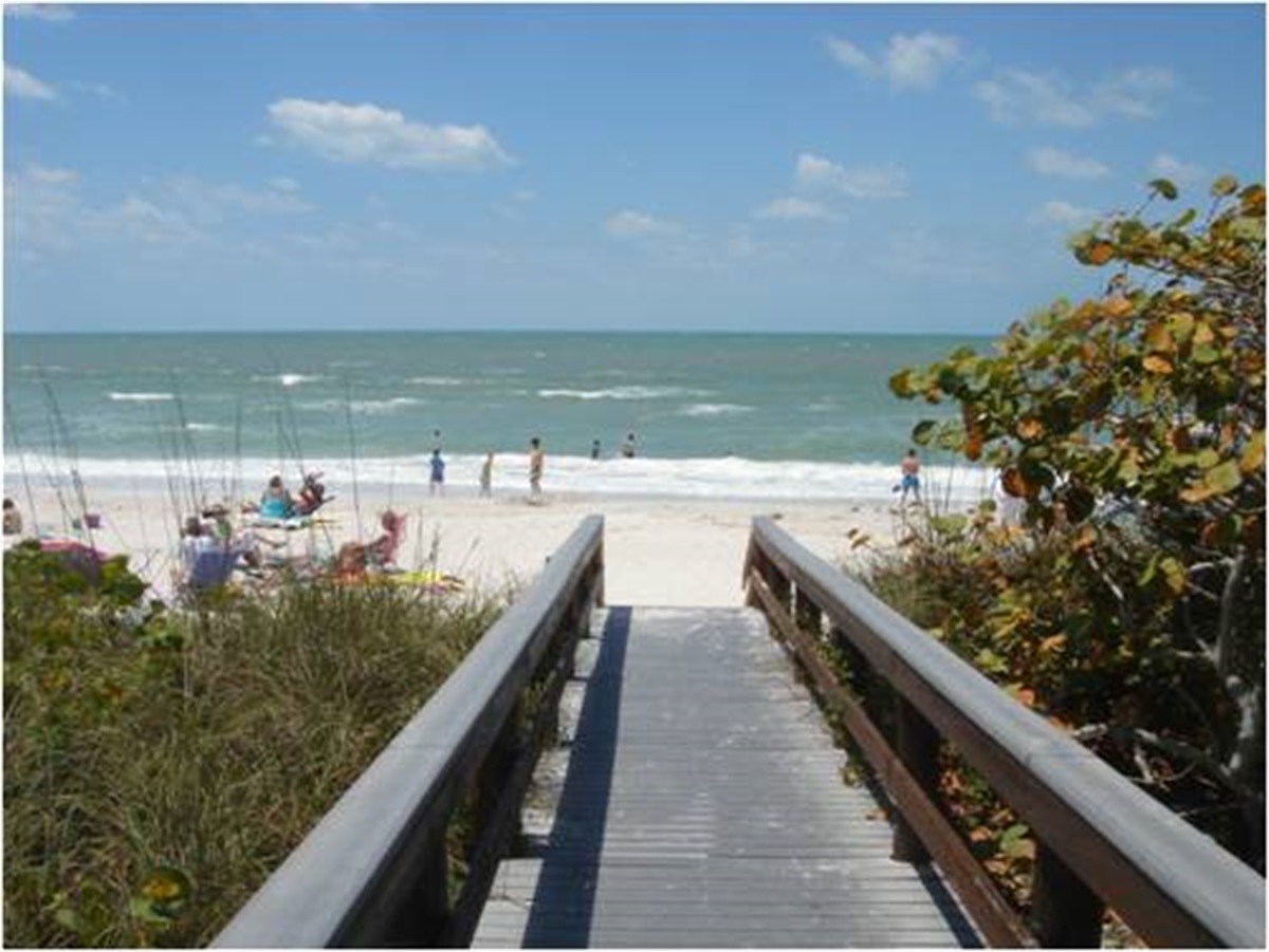 Wooden beach access walkway toward the Gulf at Barefoot Beach Access
