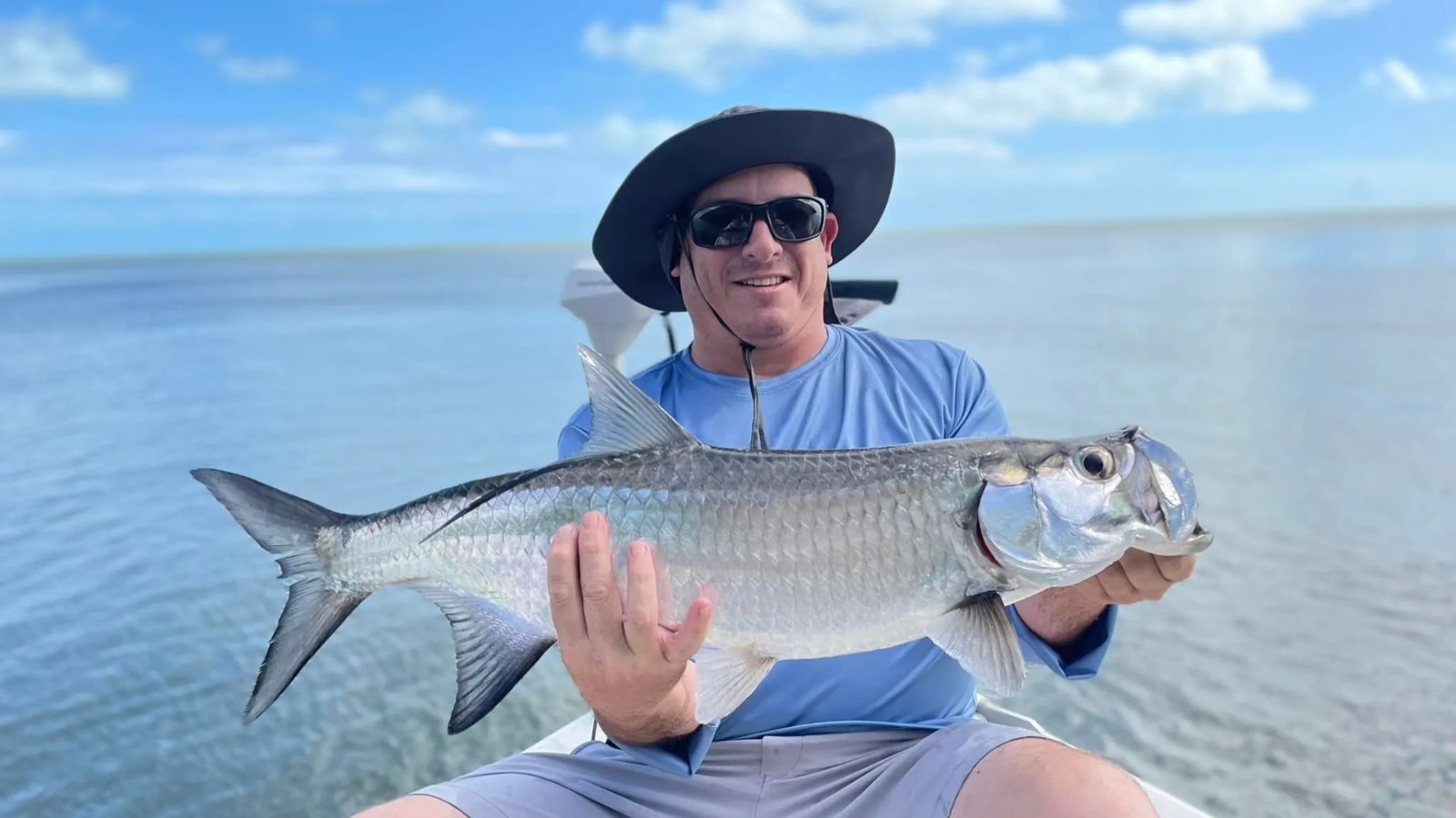BF Guide Service angler holding a tarpon