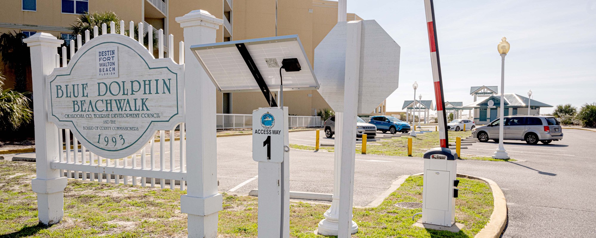 Blue Dolphin Beachwalk sign and beach access entrance