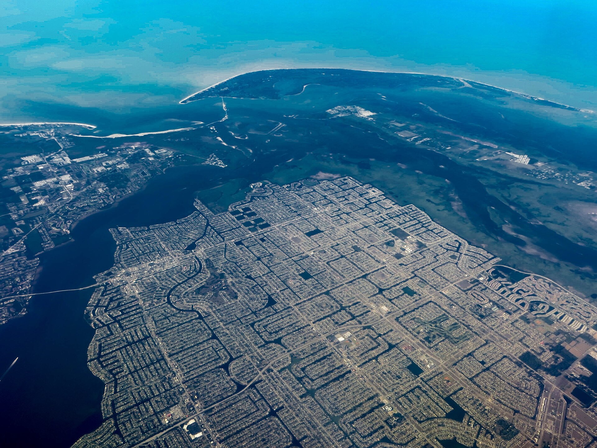 Aerial view of Cape Coral canals, neighborhoods and the Caloosahatchee River