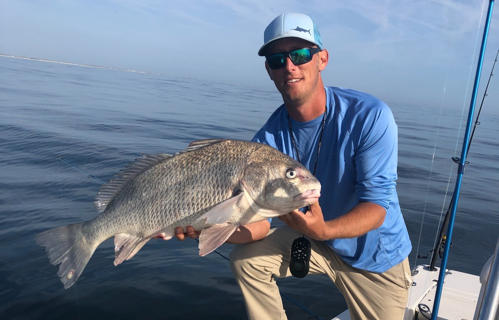 Captain Chris Fishing Charters angler with a black drum