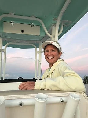 Captain Joyce at the helm of the JoyFish boat