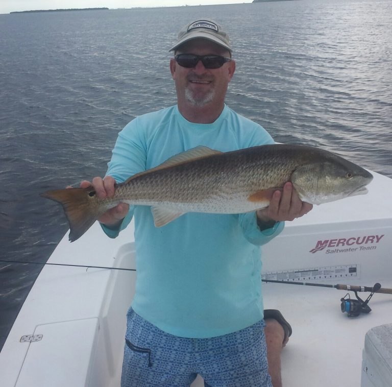 Captain Morgan Fishing angler displaying a snook