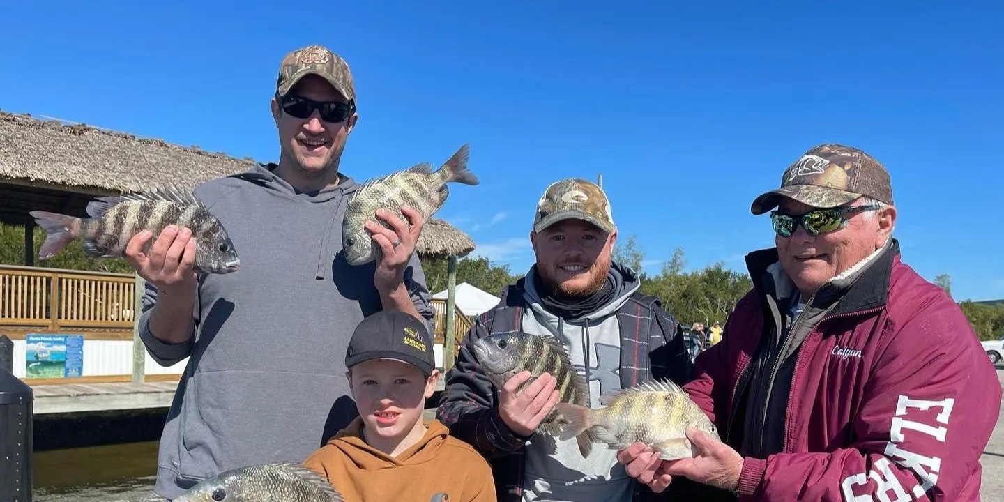 Family showing sheepshead from a Thrill of It All fishing trip