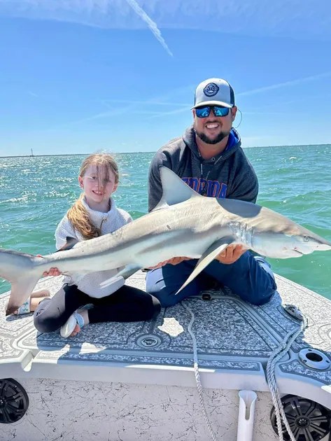 Florida Raised Fishing Adventures captain and child holding a snook