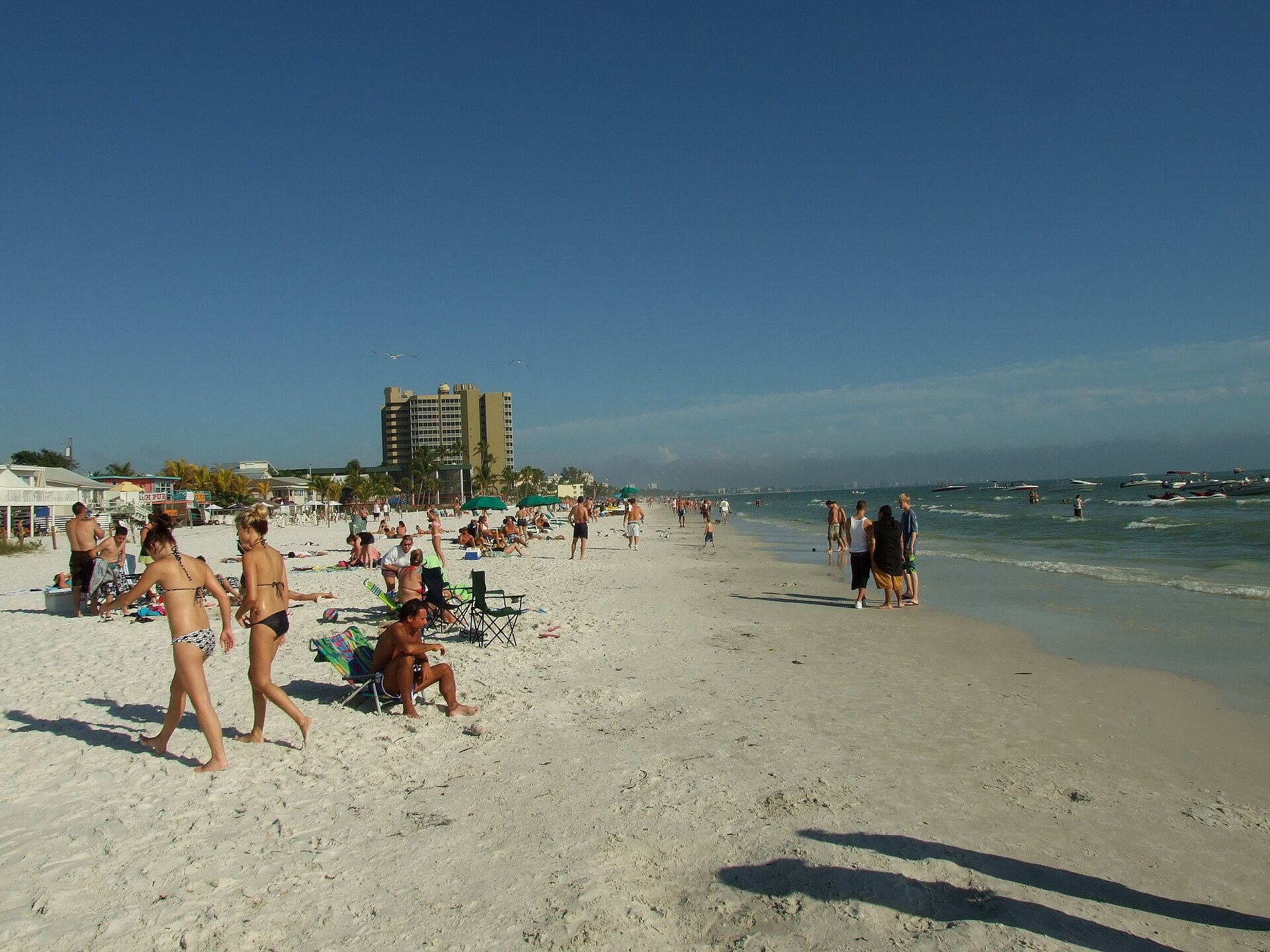 People walking along the Gulf beach at Fort Myers Beach in 2008