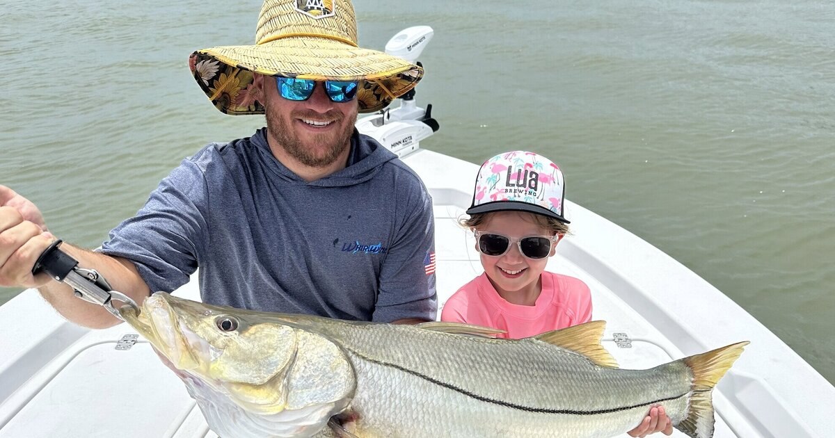 Funk Charters adult and child holding a snook