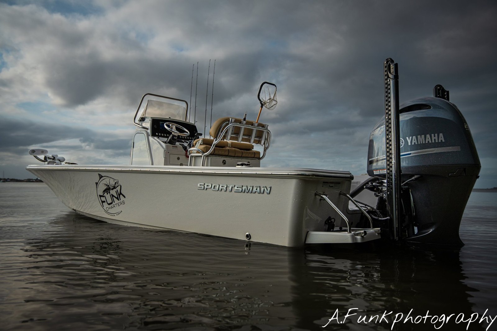 Funk Charters bay boat floating beside the dock