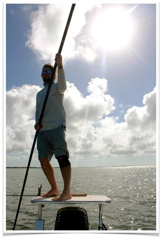 Guide poling a skiff on a Lower Keys flat